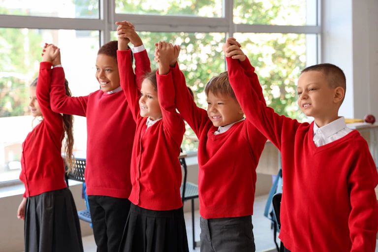 Children in uniform holding hands