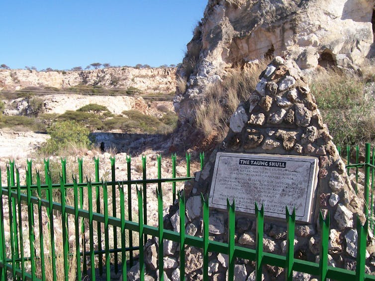 Old limestone quarry with plaque marking Taung fossil discovery