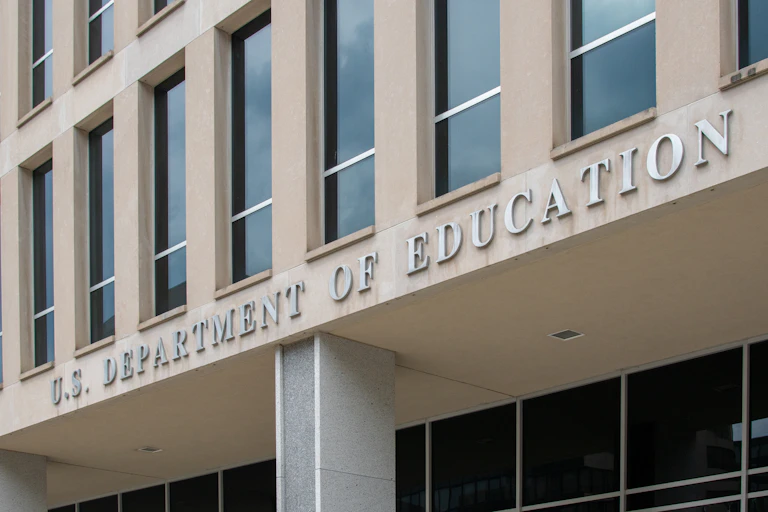 A building with the words 'U.S. Department of Education' that bedeck the facade.