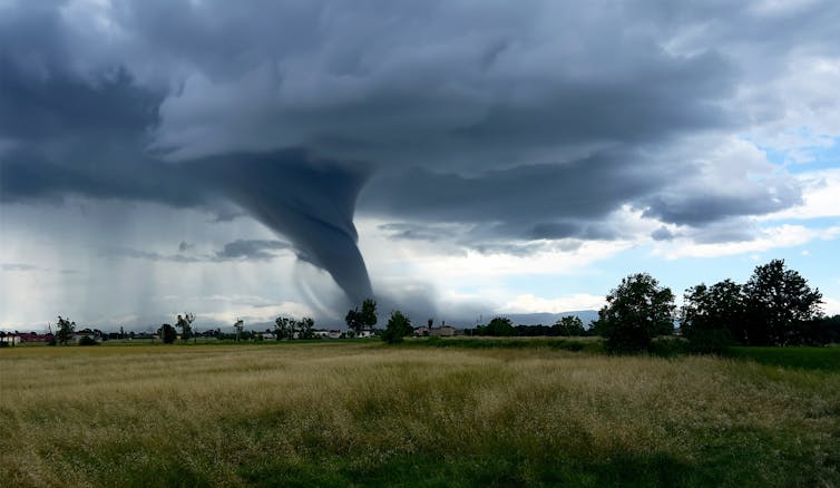 tornado forming over farmland