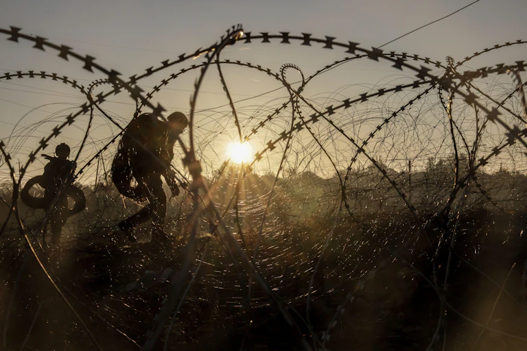 A Ukrainian soldier lays anti-tank mines along Ukraine's defensive frontline with Russia, October 2024.