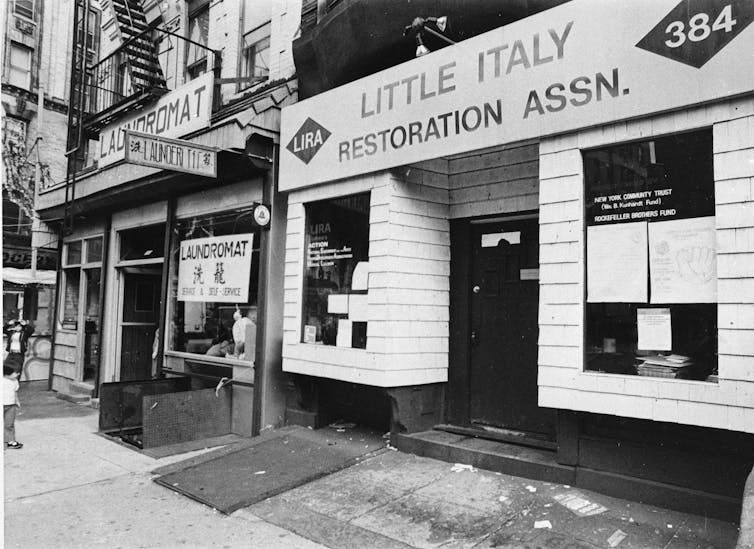 Two ship fronts are seen one with ' Little Italy Restoration Association' on it