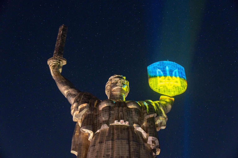 Shield of the Motherland Monument being light up in the Ukrainian colors