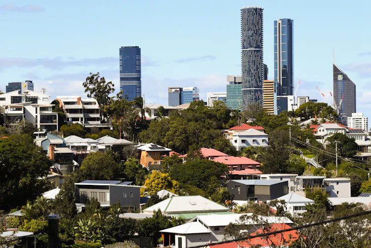 Houses in front of high rise buildings in Brisbane.