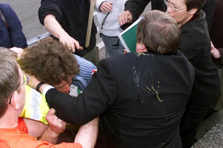 John Prescott, covered in egg, brawling with a member of the public.