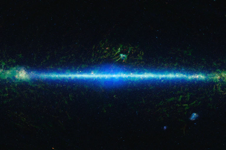 Space, with a bright line in the center representing stars and galaxies.