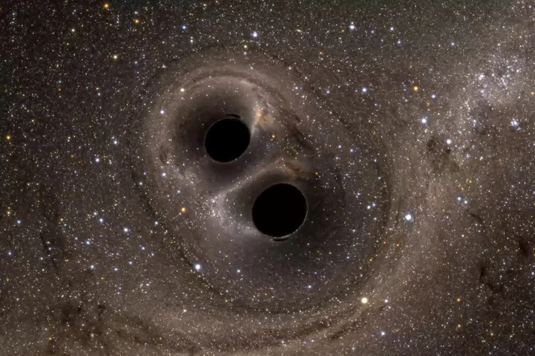 Two dark holes close together in space.