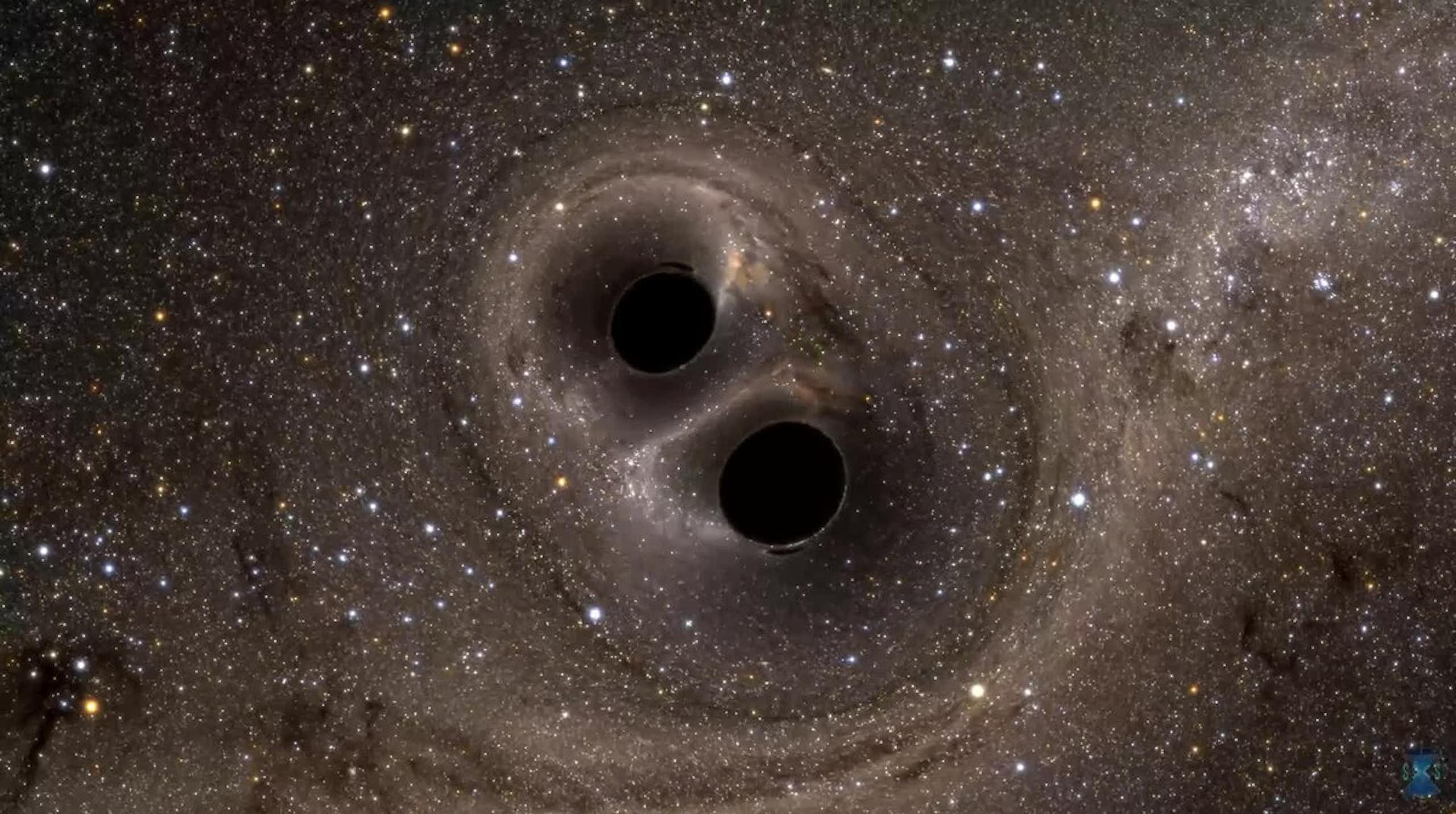 Two dark holes close together in space.