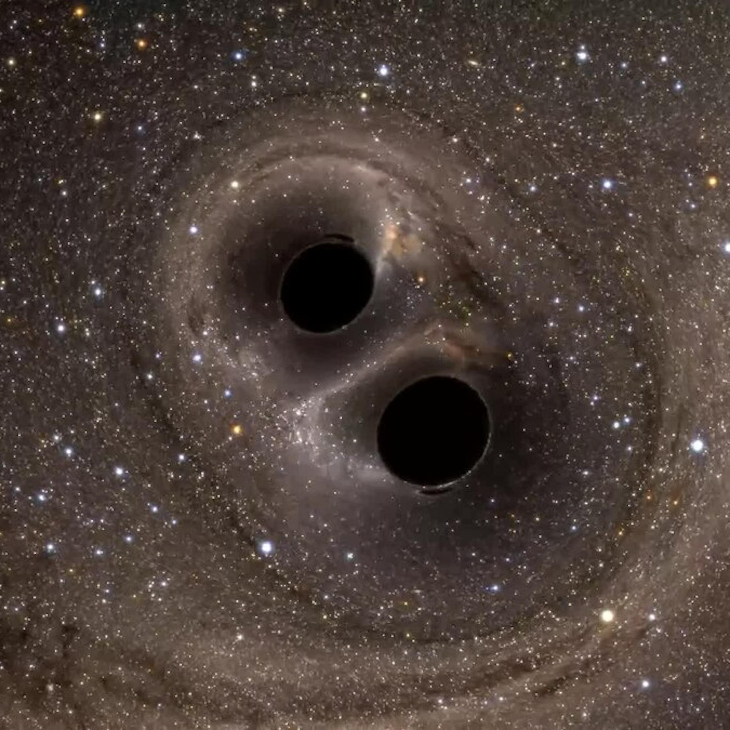 Two dark holes close together in space.