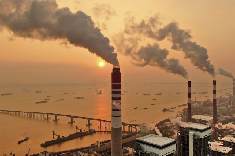 smoke billows from chimneys