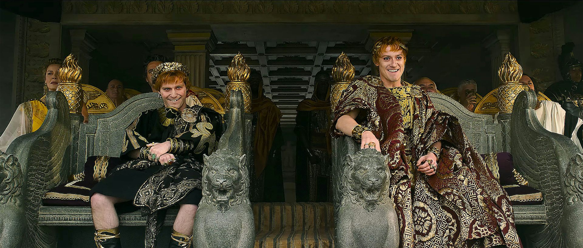 Fred Hechinger and Joseph Quinn in Roman dress, sat on thrones.
