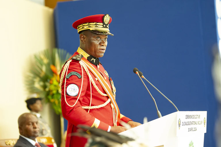 Man in military uniform standing at a podium