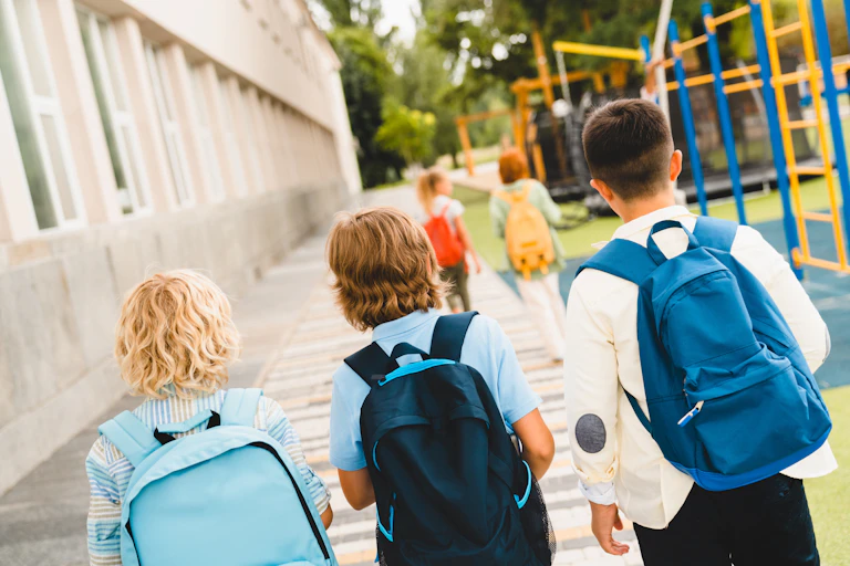 Children walking through playground to school
