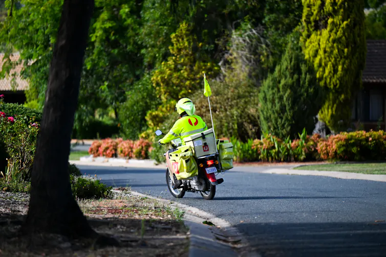 Mail is delivered by an Australia Post employee in Canberra