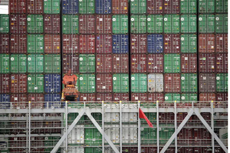 A large tower of multi-coloured cargo containers.