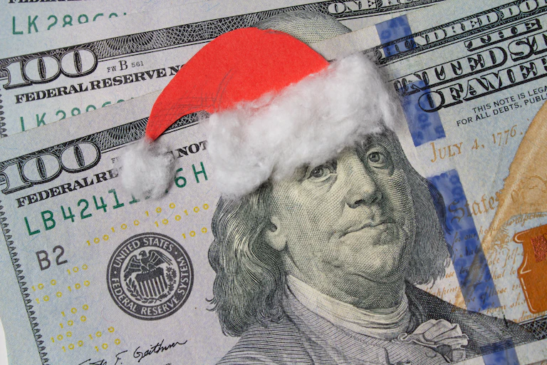 https://www.gettyimages.com/detail/photo/benjamin-franklin-in-a-santa-claus-hat-on-a-bill-royalty-free-image/1076895252