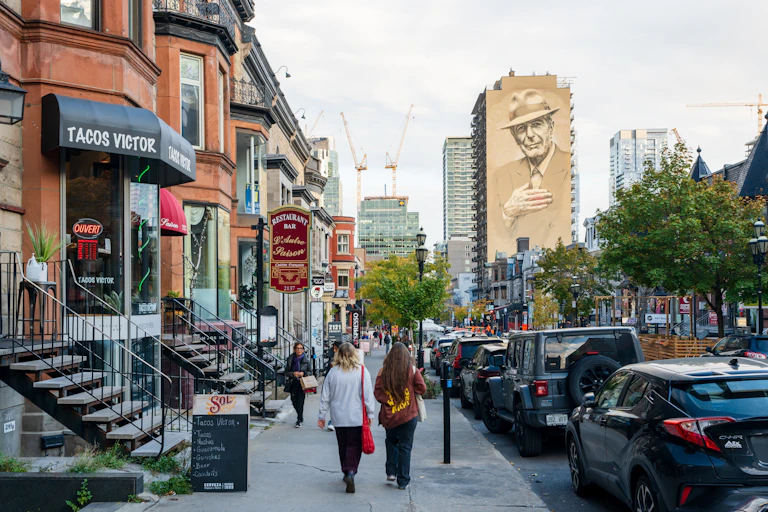 People walking on the sidewalk in the city center