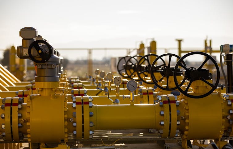 Bright yellow gas pipes connecting transmission networks