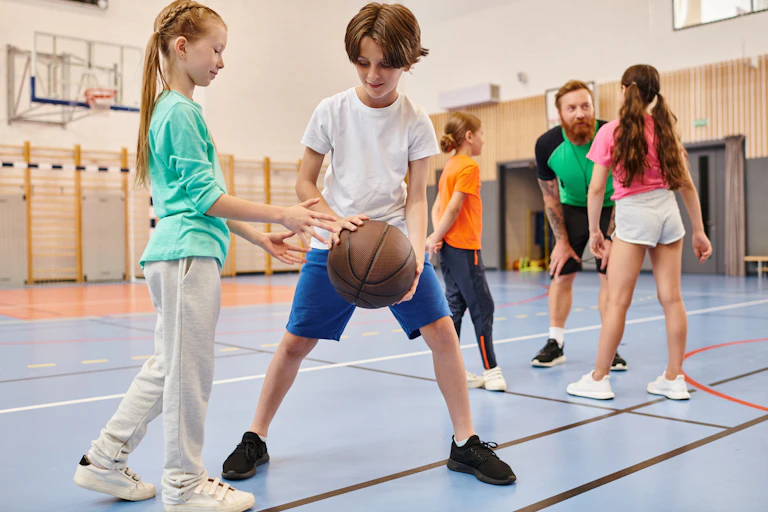 children play basketball