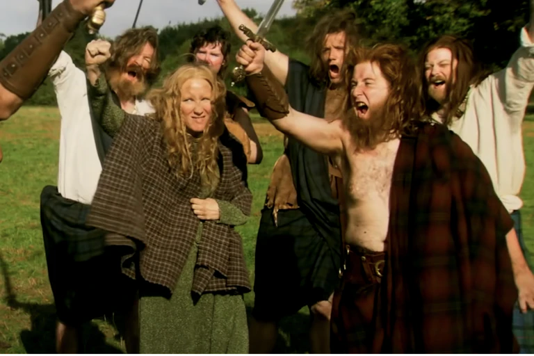 A group of actors dressed as Middle Ages Scots.