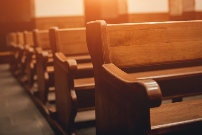 Rows of empty church pews
