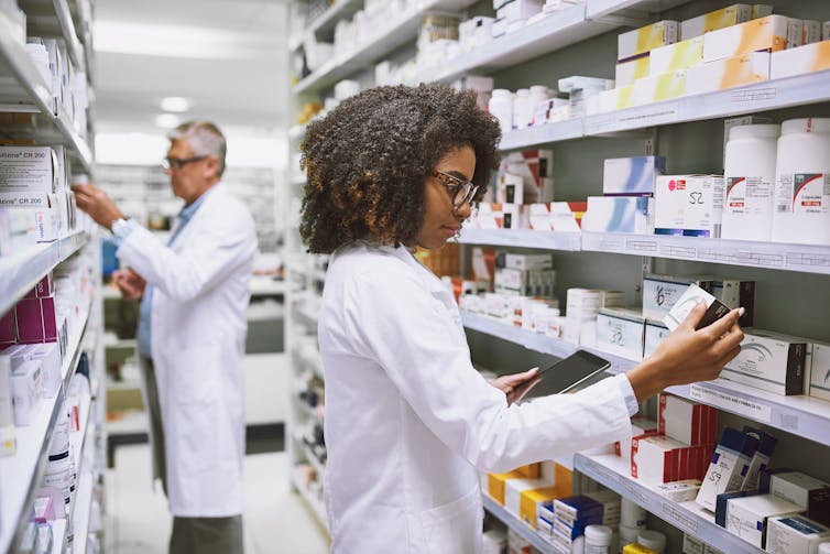 Pharmacists look at medicines