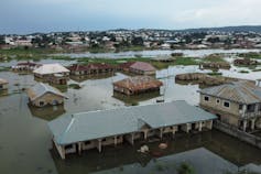 Dozens of houses half submerged under water