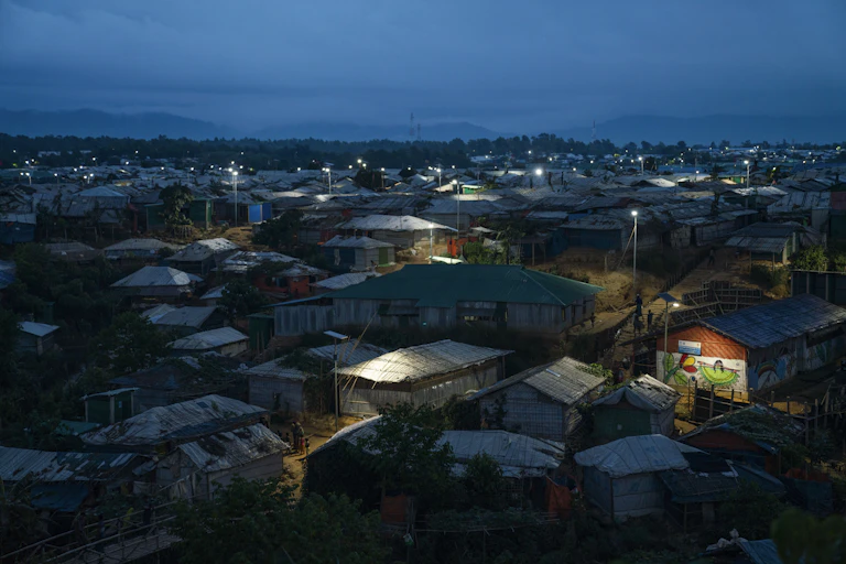 A refugee camp at dusk.