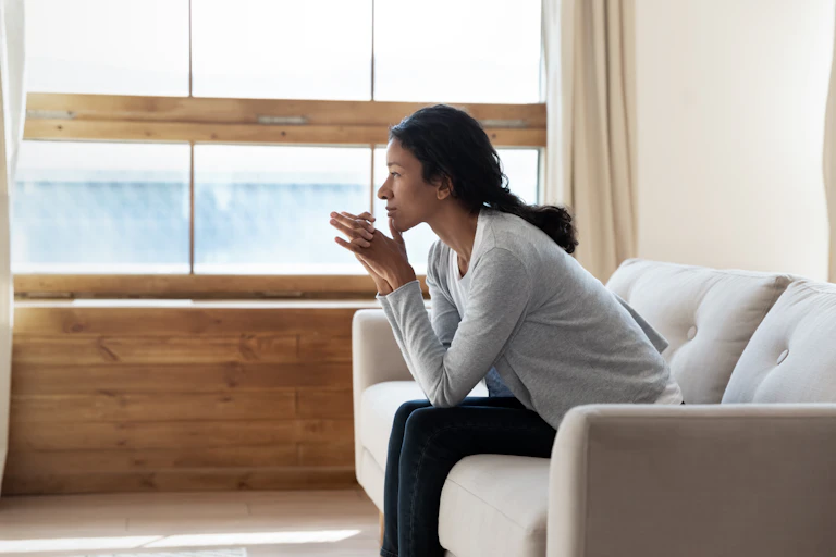A woman sitting on a couch.