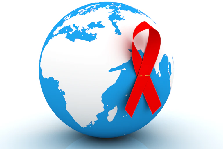 A blue globe showing the African continent in white, with a red ribbon pinned to it