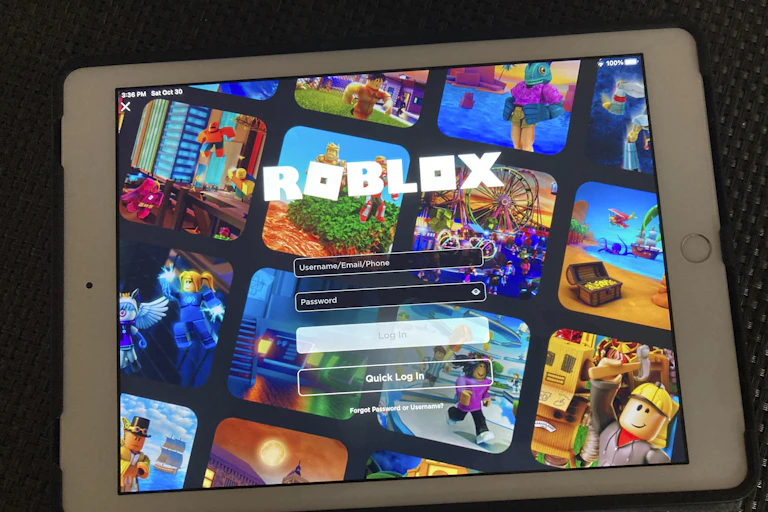 A tablet displaying the login screen for the game Roblox