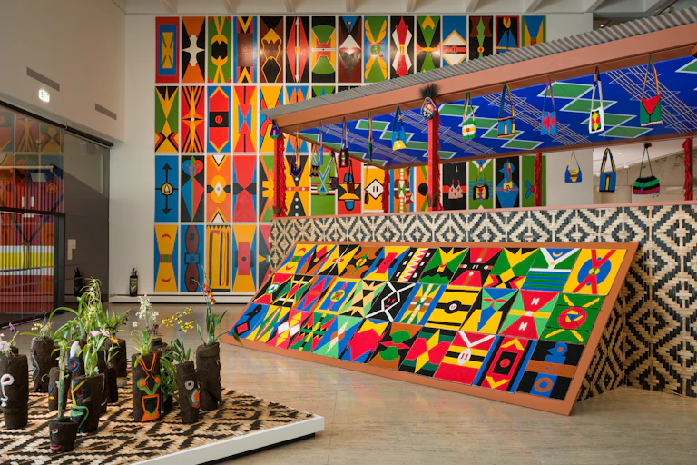 Brightly coloured abstract paintings.