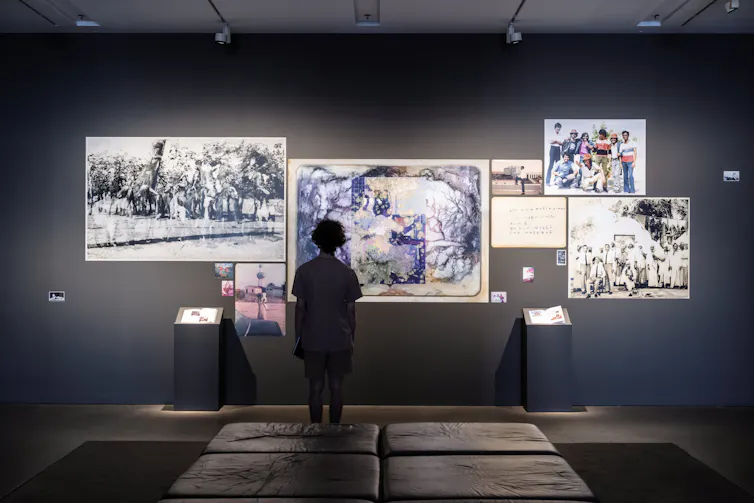 Someone looks at artworks.