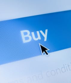 Close up of a mouse on a buy button