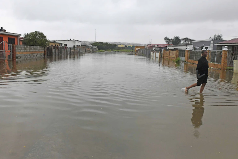 A street of ordinary houses that has been flooded