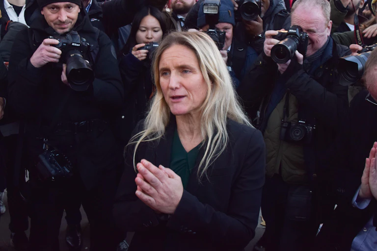Kim Leadbeater in front of press photographers