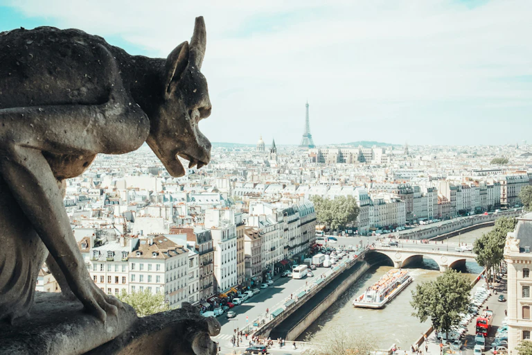 A gargoyle and a view across Paris