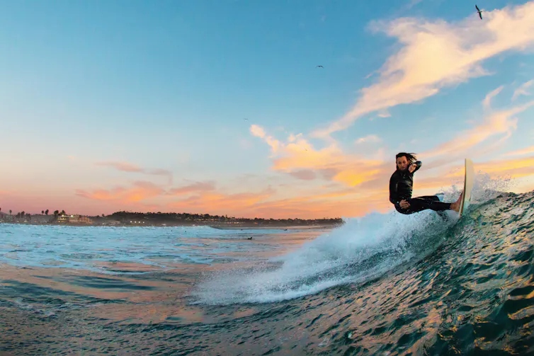 Man surfing a wave.