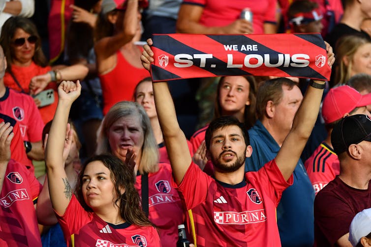 The stands of CITYPARK are seen filled with red-clad St. Louis soccer fans.