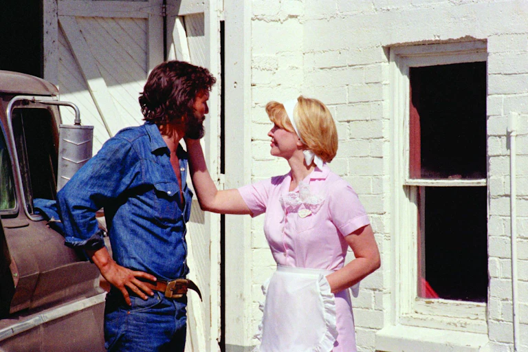 Film Still of a woman and man talking