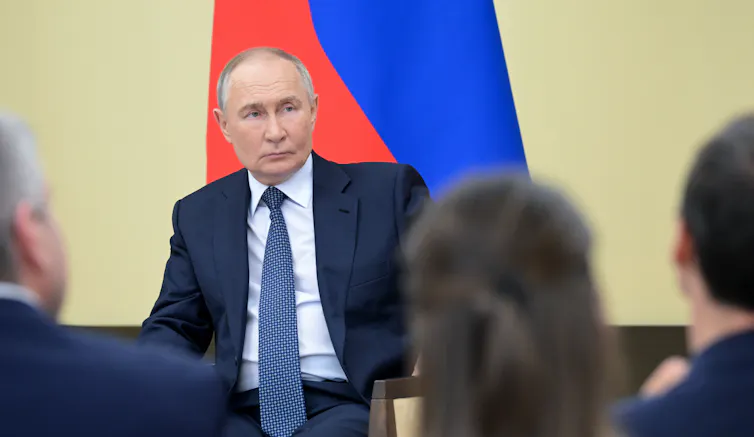 Putin addressing a crowd of people.