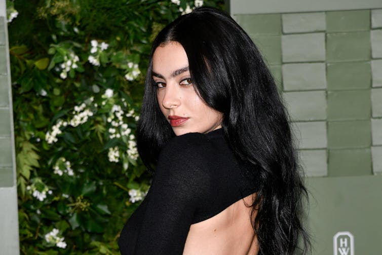 Charli XCX in a black backless dress