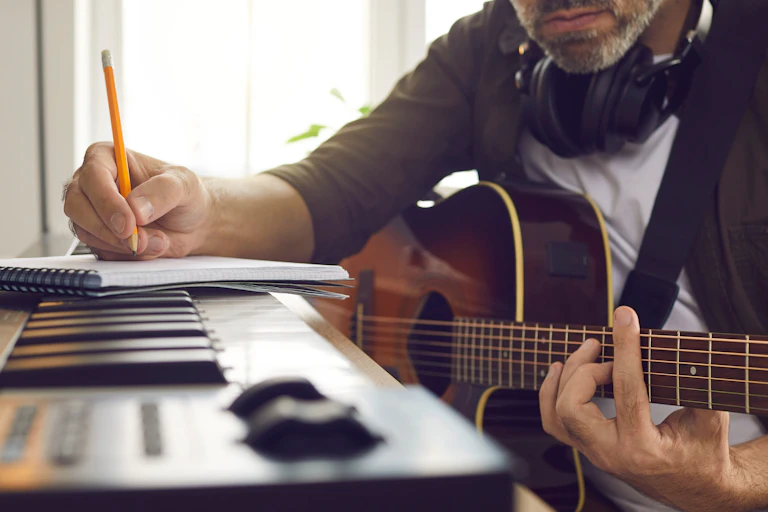 Man writing music