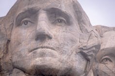 A stone carving of a man's face.