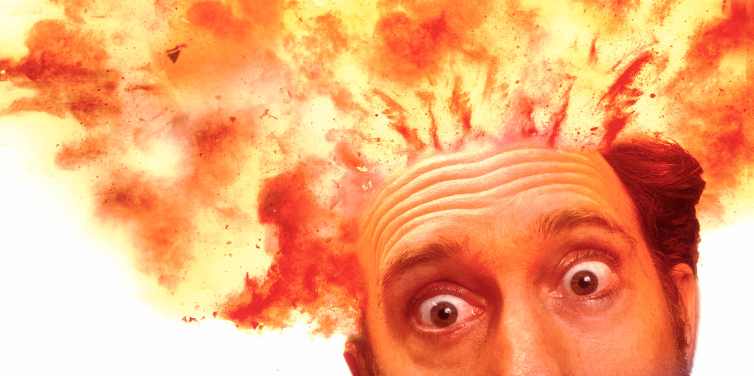 A man's head exploding at the top in flames.