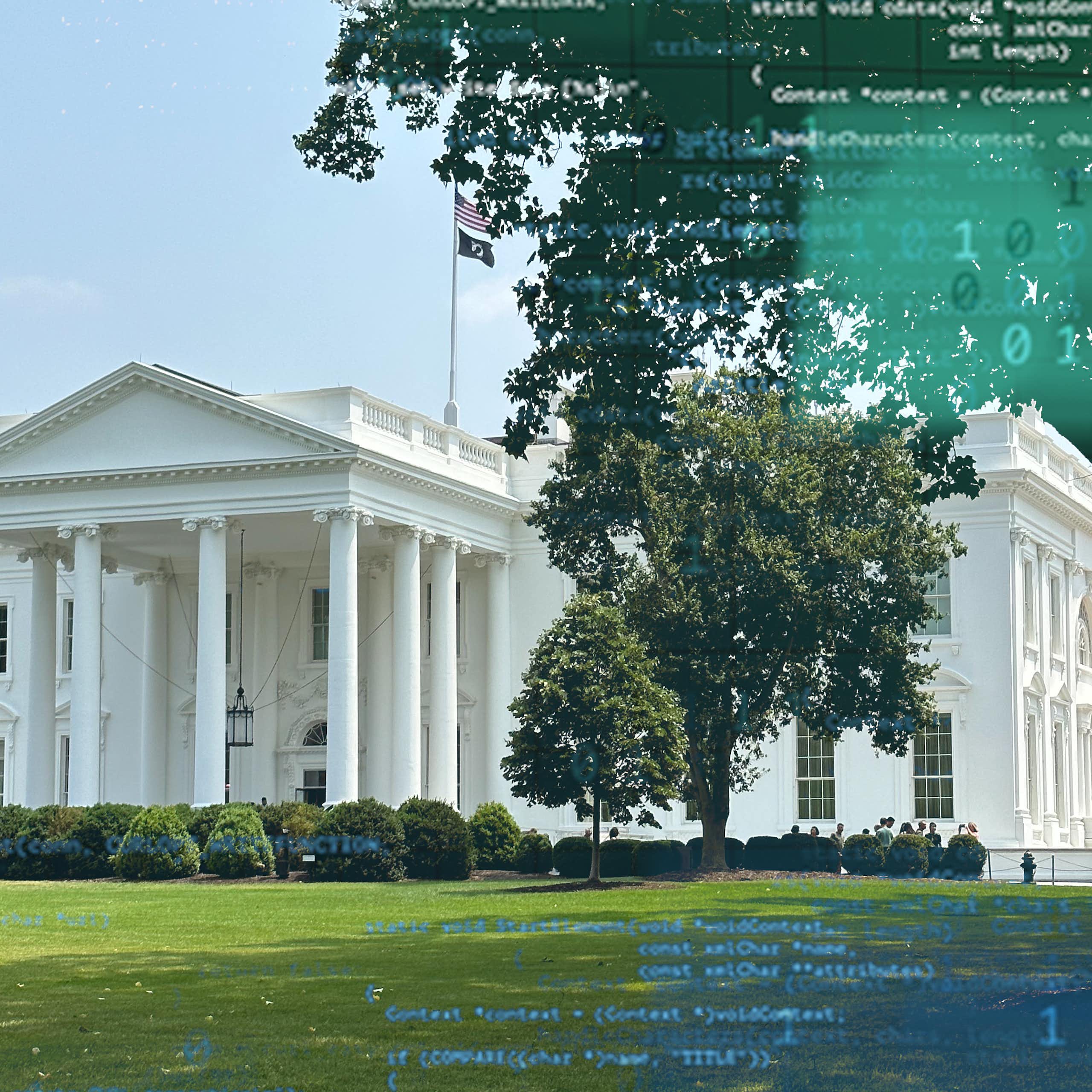A large white, columned mansion surrounded by a lawn.