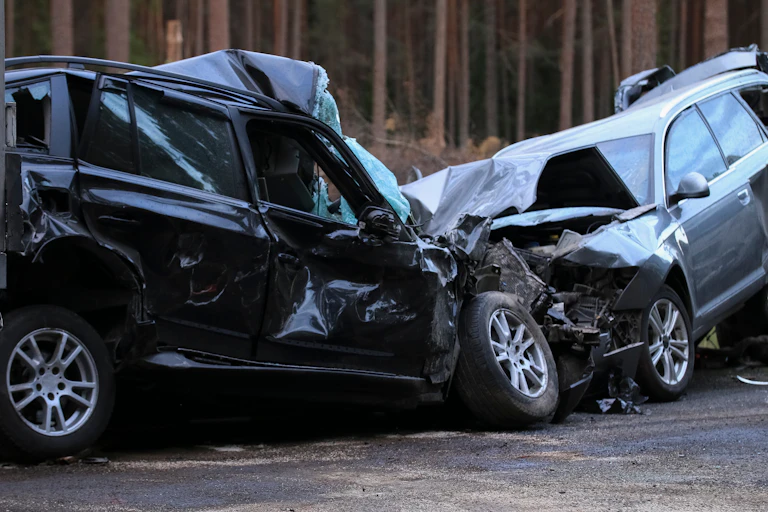 Two crushed cars in a head-on crash