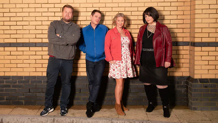 The characters from Gavin & Stacey standing against a brick wall