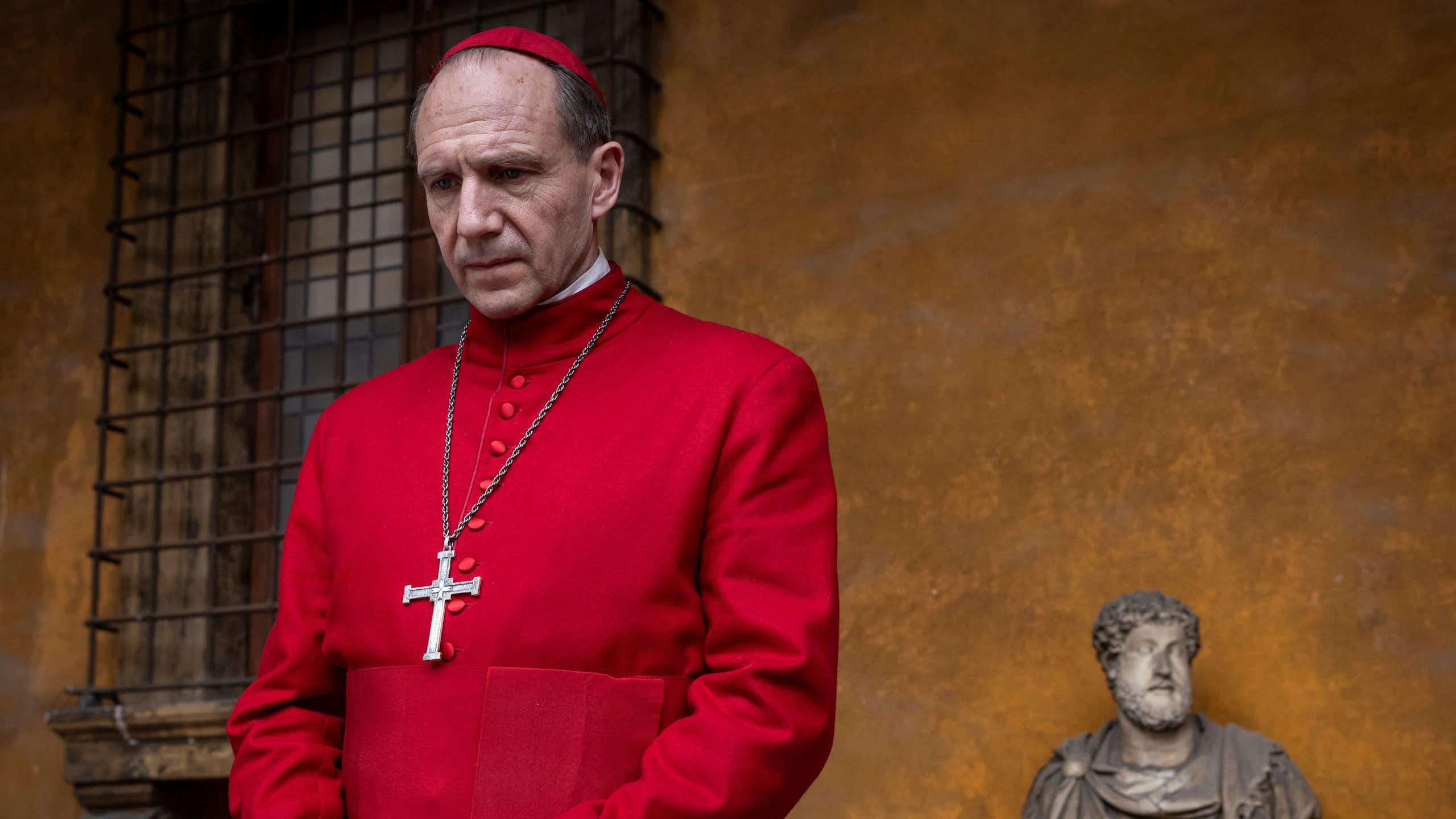 A cardinal dressed in scarlet robes in the Vatican.