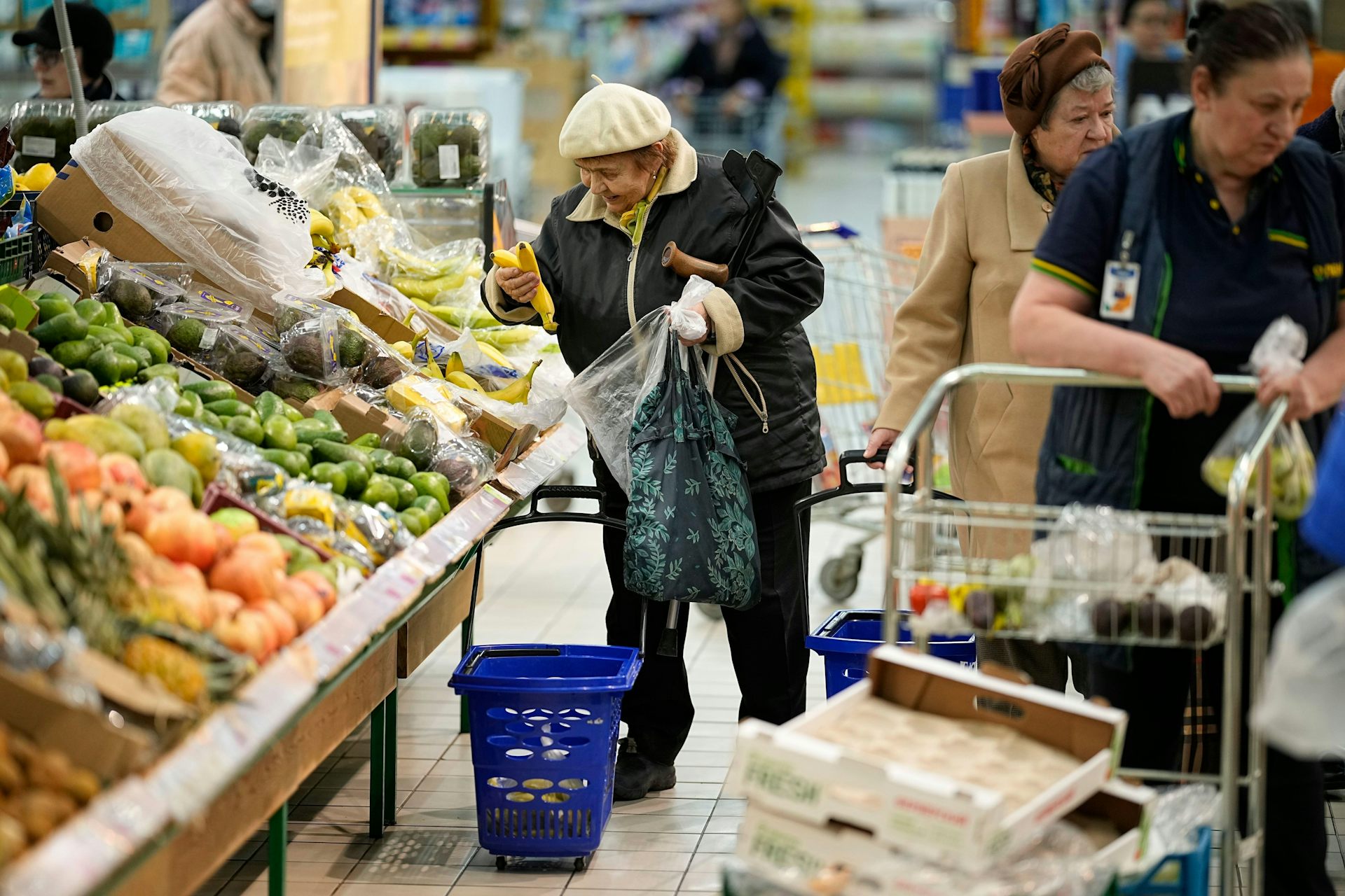 Russian shoppers look at fruit and vegetables.